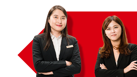 Two smiling female HSBC colleagues with arms folded